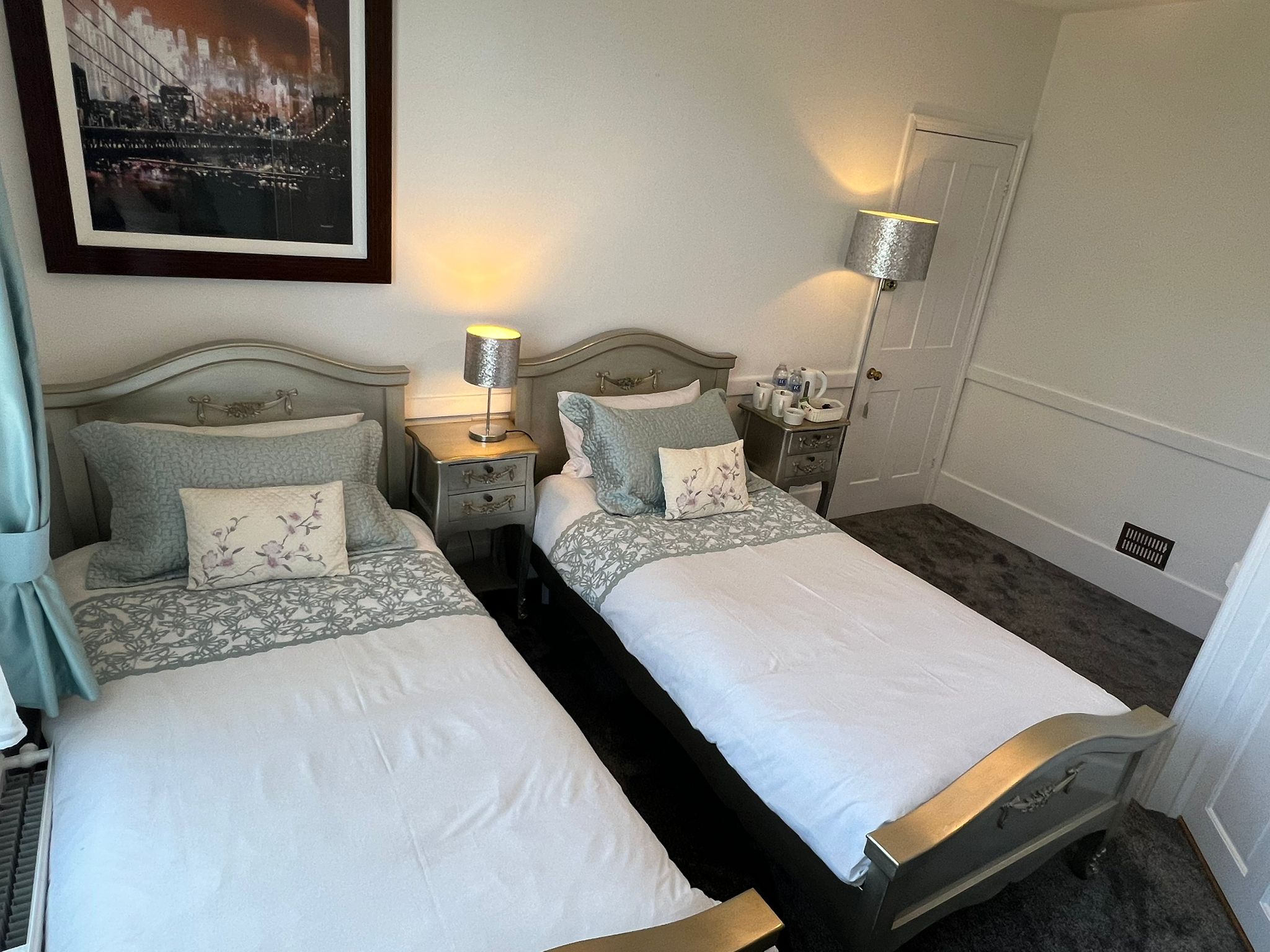 Twin Room — two single beds with silver French headboards
